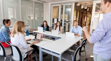 Assistant Director of the MIT-Boston University Startup Law Clinic, Samuel Taylor, right, speaks to participants.Photo: Dan Watkins, Boston University Photography